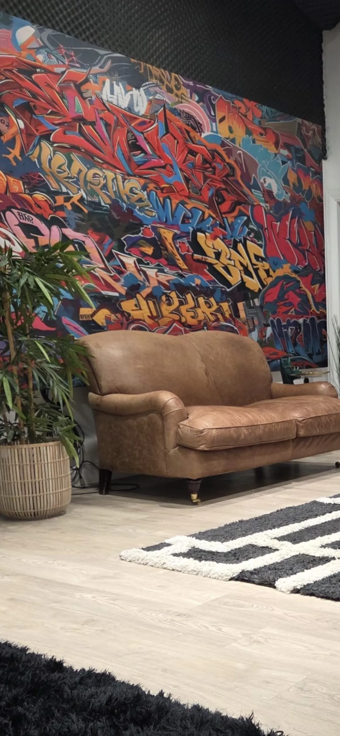 Leather sofa against the graffiti wall